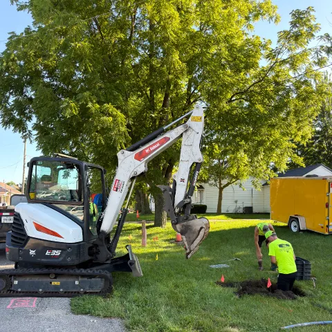 An NPTech crew placing fiber in a New Paris yard
